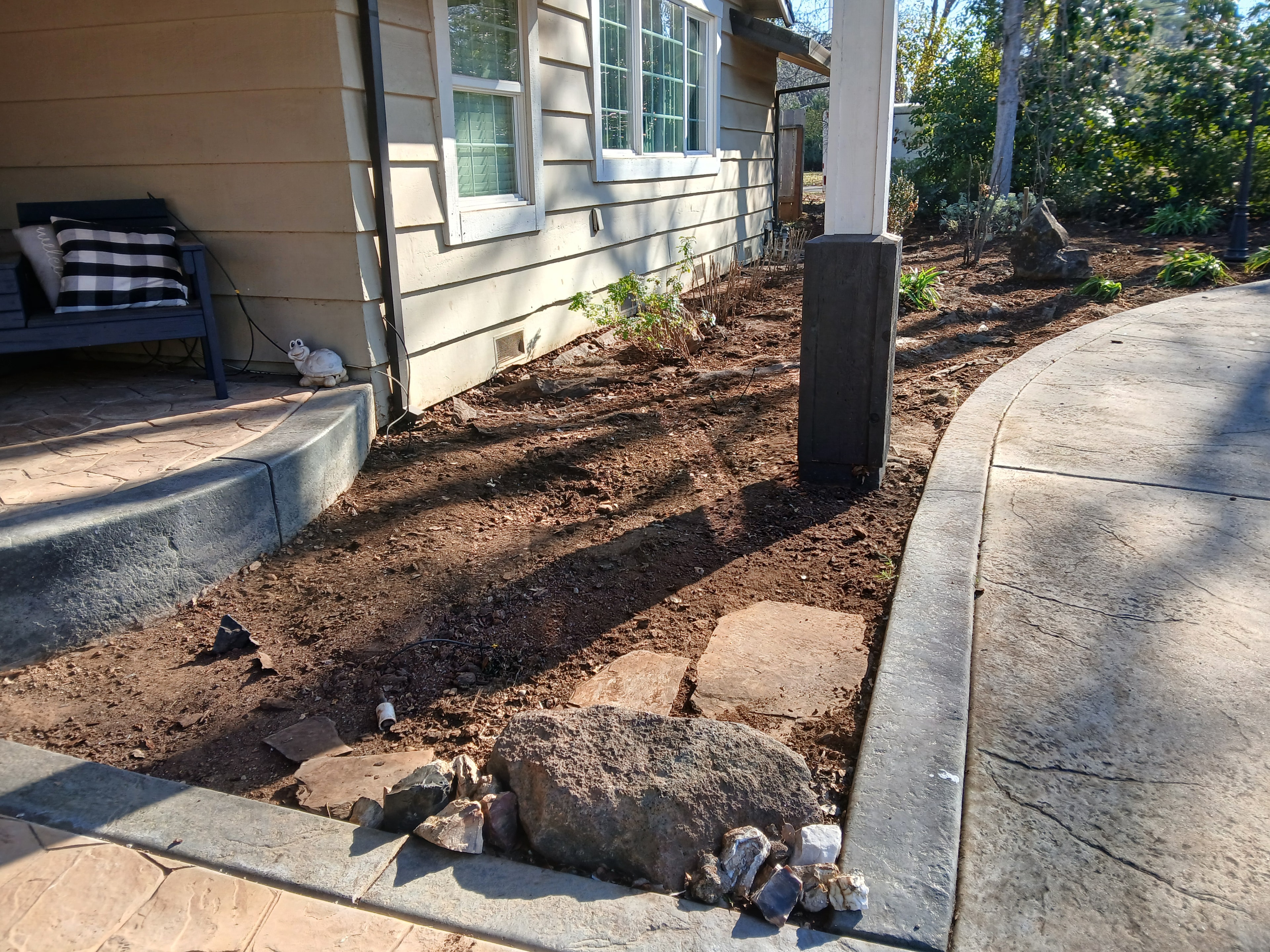 Garden bed prep and cleanup along driveway